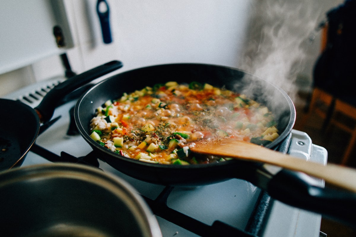 Nutrition expert preparing and measuring meal ingredients in a professional kitchen